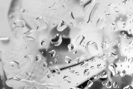 abstract background with water drops on glass for background or backdropの写真素材