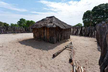 Traditional african village with housed and wooden fence in Namibia, near town Kavango in region with the highest poverty level in Namibiaの写真素材