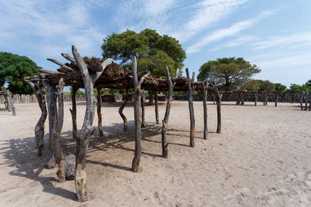 Traditional african village with housed and wooden fence in Namibia, near town Kavango in region with the highest poverty level in Namibiaの写真素材