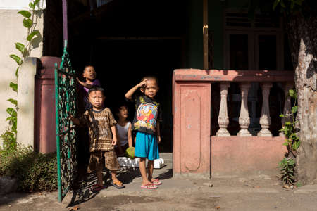 MANADO, NORTH SULAWESI, INDONESIA - AUGUST 5, 2015: Indonesian children in Manado shantytown on August 5, 2015 in Manado, North Sulawesi, Indonesiaのeditorial素材