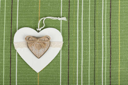 valentine's wooden hearts on fabric , valentine's day, day valentine postcard with space for textの写真素材