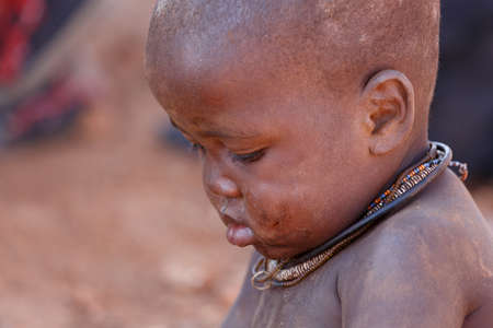 NAMIBIA, KAMANJAB, OCTOBER 10: Unidentified child Himba tribe. The Himba are indigenous peoples...