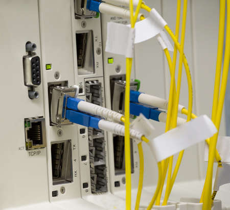 service provider data center with media converters and optical cables