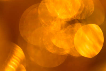 Abstract blurry christmas background. Blurred colorful circles bokeh of christmas lightsの写真素材