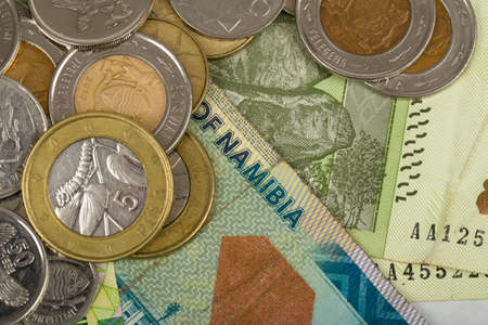 South african countries banknotes and coins for background. Botswana pula, Namibian dollar, South...