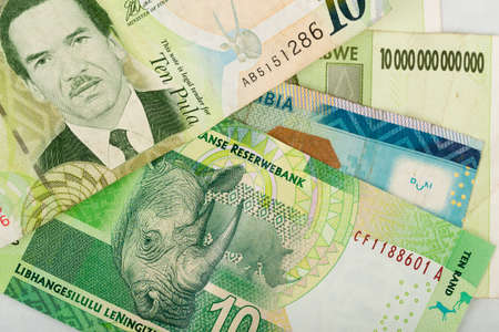 South african countries banknotes for background. Botswana pula, Namibian dollar, South Africa rand and Zimbabwe dollars.の写真素材