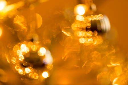 Abstract blurry christmas background. Blurred colorful circles bokeh of christmas lightsの写真素材