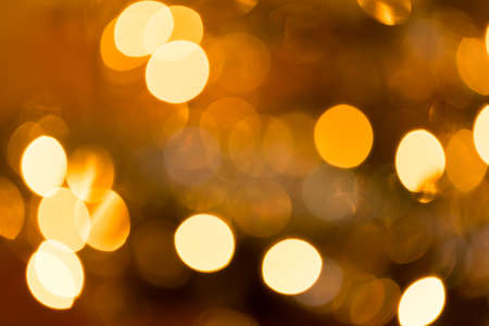 Abstract blurry christmas background. Blurred colorful circles bokeh of christmas lightsの写真素材