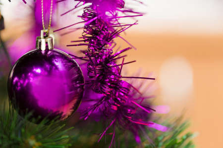 detail of decorated christmas tree with violet ballsの写真素材