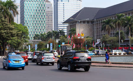 JAKARTA - August 10: Traffic on main street in central Jakarta. August 10, 2015 in Jakarta, Indonesia.のeditorial素材