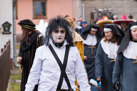 PUKLICE, CZECH REPUBLIC - JANUARY 13, 2016: People attend the Masopust Carnival, a traditional ceremonial door-to-door procession in small village. January 13, 2016 in Puklice, Czech Republicのeditorial素材