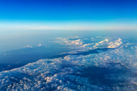 Big white cloud and blue sky background,view from airplane, earth view, blue and white cloudsの写真素材