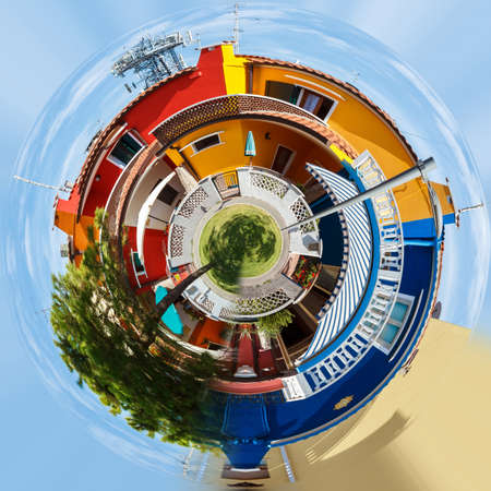 Planet of Colorful buildings in street, Italy, Caorle sunny day. Little planet concept. Tiny green projectionの写真素材