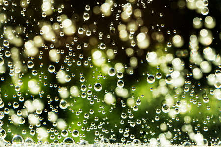 abstract background with sparkle water, drops on glass for background or backdrop. Natural red water...