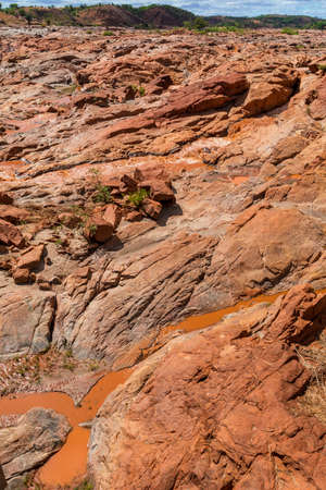 Betsiboka River stream with red sediments. In rainy season flooding its banks and flooding nearby. Maevatanana, Mahajanga province. Madagascar.の写真素材