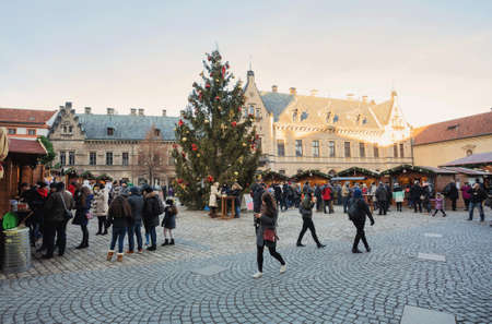 PRAGUE, CZECH REPUBLIC - DECEMBER 3, 2016: Peoples on the famous advent Christmas market at st. Vitus cathedral Square with christmas tree in Prague. It is very popular destination with tourists visiting Prague. December 3, 2016 Prague, Czech Republic.のeditorial素材