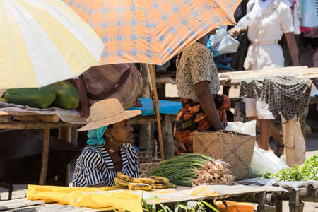 MAROANTSETRA ,MADAGASCAR OCTOBER 18.2016 Malagasy peoples on big colorful rural marketplace on main street of Maroantsetra city. Everyday ordinary life on street. Madagascar, October 18. 2016のeditorial素材
