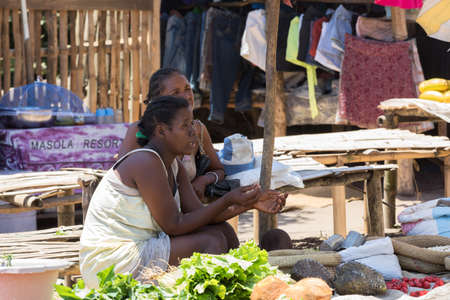 MAROANTSETRA ,MADAGASCAR OCTOBER 18.2016 Malagasy peoples on big colorful rural marketplace on main street of Maroantsetra city. Everyday ordinary life on street. Madagascar, October 18. 2016のeditorial素材