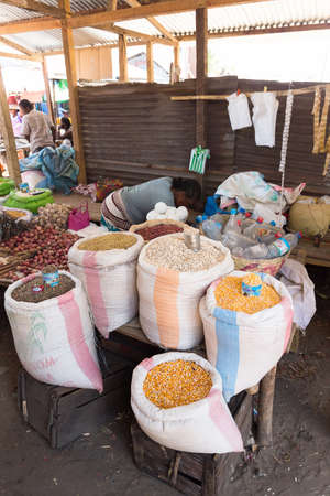 MAROANTSETRA ,MADAGASCAR OCTOBER 18.2016 Malagasy peoples on big colorful rural marketplace on main street of Maroantsetra city. Everyday ordinary life on street. Madagascar, October 18. 2016のeditorial素材