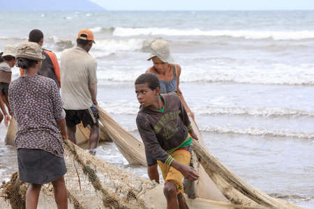 MAROANTSETRA, MADAGASCAR OCTOBER 19.2016 Native fishermen fishing on sea, using traditional technique pulling net from boat. Life of indigenous peoples in countryside. October 19. 2016, Madagascarのeditorial素材
