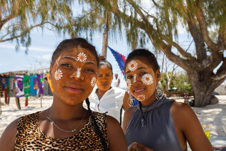 ANTSIRANANA, DIEGO-SUAREZ, MADAGASCAR, OCTOBER 29.2016, Native Malagasy Sakalava ethnic girls, beauties with decorated face on the beach in Diego Suarez Bay, Madagascar, October 29. 2016のeditorial素材