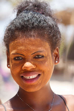 ANTSIRANANA, DIEGO-SUAREZ, MADAGASCAR, OCTOBER 29.2016, Native Malagasy Sakalava ethnic girls, beauties with decorated face on the beach in Diego Suarez Bay, Madagascar, October 29. 2016のeditorial素材