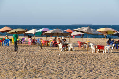 TOAMASINA, MADAGASCAR OCTOBER 17.2016: Malagasy teenager boys resting on the beach in the second largest city of Madagascar. In October 17. 2016, Toamasina, Madagascarのeditorial素材