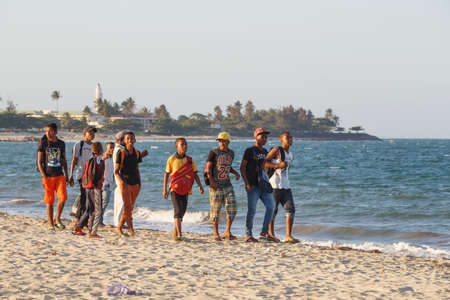 TOAMASINA, MADAGASCAR OCTOBER 17.2016: Malagasy teenager boys resting on the beach in the second largest city of Madagascar. In October 17. 2016, Toamasina, Madagascarのeditorial素材