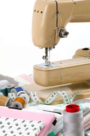 Sewing machine, cotton cotton fabric and tailor measurement tape with spools of thread cotton...