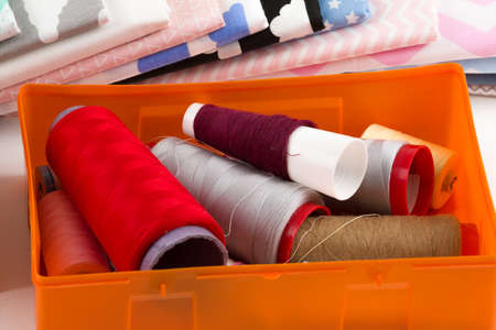 cotton fabric material, tailor measurement tape with spools of thread cotton
