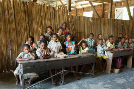MADAGASCAR OCTOBER 17.2016: Malagasy school children students in rural classroom, Maroantsetra - Andranofotsy, October 20. 2016, Madagascarのeditorial素材