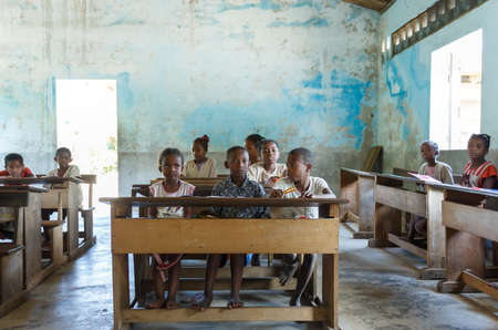 MADAGASCAR OCTOBER 17.2016: Malagasy school children students in rural classroom, Maroantsetra - Andranofotsy, October 20. 2016, Madagascarのeditorial素材