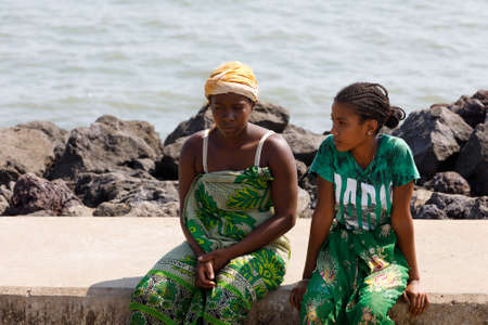 NOSY BE ,MADAGASCAR - NOVEMBER 3.2016 Malagasy woman waiting for transport ship in Nosy Be port. Nosy be, Madagascar, November 3. 2016のeditorial素材