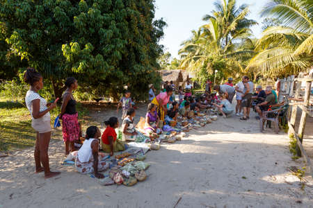 MAROANTSETRA, MADAGASCAR OCTOBER 23.2016 Malagasy woman from village selling traditional souvenir village street. Madagascar countryside scene. Maroantsetra, Madagascar October 23. 2016のeditorial素材