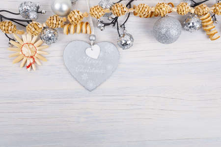 vintage merry christmas retro wooden background with straw decorationの写真素材