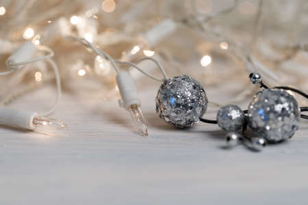 white christmas lights on retro vintage wooden background with shallow focusの写真素材