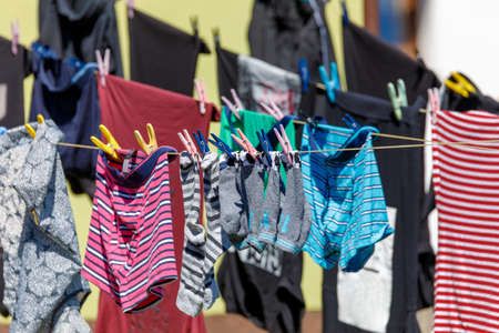 Home washed laundry drying outside in sunny dayの写真素材