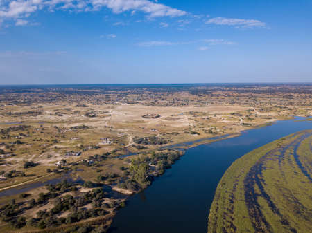 Aerial landscape in Okavango delta on Namibia and Angola border. River with shore and green vegetation after rainy season. Africa aerial landscape.の写真素材