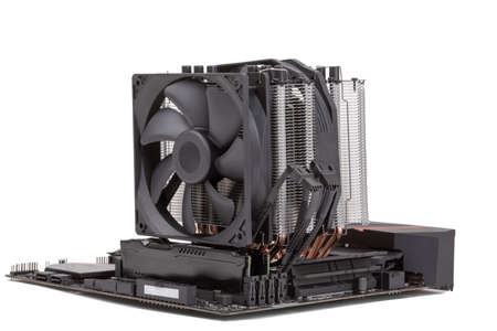 gaming PC mainboard - motherboard with installed CPU and Cooler with heat-pipes and ventilator fan...