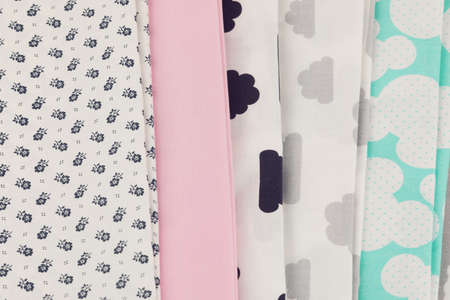 Stack of 100% cotton fabric material for tailor or homework, sewing concept