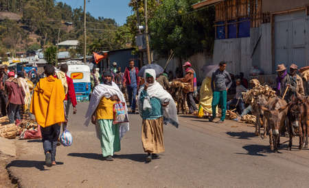 Debre Libanos, Ethiopia - April 19, 2019: Ethiopian People on the street behind famous Monastery...
