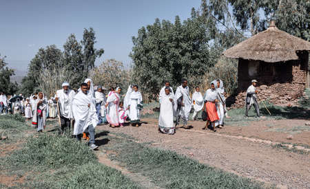 LALIBELA, ETHIOPIA, MAY 1st. 2019, Orthodox Christian Ethiopian believer go out from mass in...