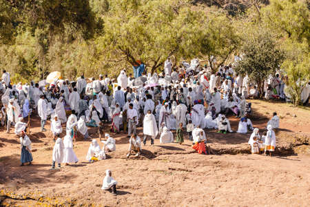 LALIBELA, ETHIOPIA, MAY 1st. 2019, Crowd of orthodox Christian Ethiopian believer in front of famous...
