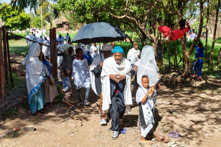 LALIBELA, ETHIOPIA, MAY 1st. 2019, Orthodox Christian Ethiopian believer go out from mass in rock-hewn St. George's Church after Mass on May 1st. 2019 in Lalibela, Ethiopiaのeditorial素材