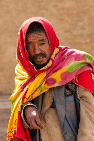 AXUM, ETHIOPIA, APRIL 27th.2019: Beggar old man on the street in front of famous Church of Our Lady...
