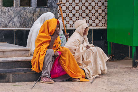 AXUM, ETHIOPIA, APRIL 27th.2019: Orthodox believers sitting in front of famous Church of Our Lady of Zion on April 27, 2019 in Aksum, Ethiopia Africaのeditorial素材