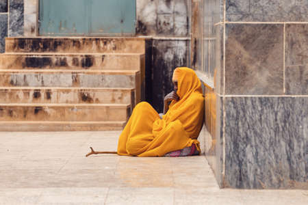 AKSUM, ETHIOPIA, APRIL 27.2019, Resting orthodox priest in front of Church of Our Lady of Zion on April 27, 2019 in Aksum, Ethiopia, Africaのeditorial素材