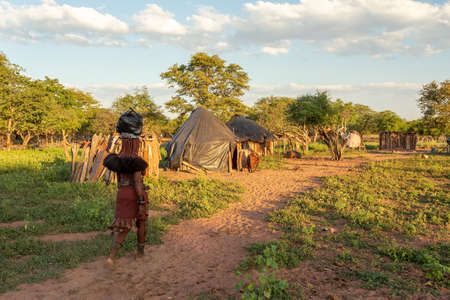 NAMIBIA, OMUSATI REGION, MAY 6: Himba woman returns from a nearby town for shopping back to the village. The Himba are indigenous namibian ethnic people, in northern Namibia, May 6, 2018, Namibiaのeditorial素材