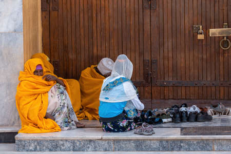 AXUM, ETHIOPIA, APRIL 27th.2019: Orthodox believers sitting in front of famous Church of Our Lady of Zion on April 27, 2019 in Aksum, Ethiopia Africaのeditorial素材