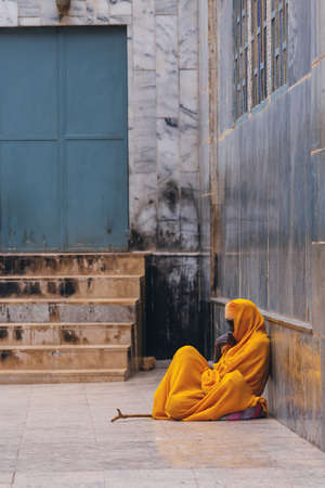 AKSUM, ETHIOPIA, APRIL 27.2019, Resting orthodox priest in front of Church of Our Lady of Zion on April 27, 2019 in Aksum, Ethiopia, Africaのeditorial素材